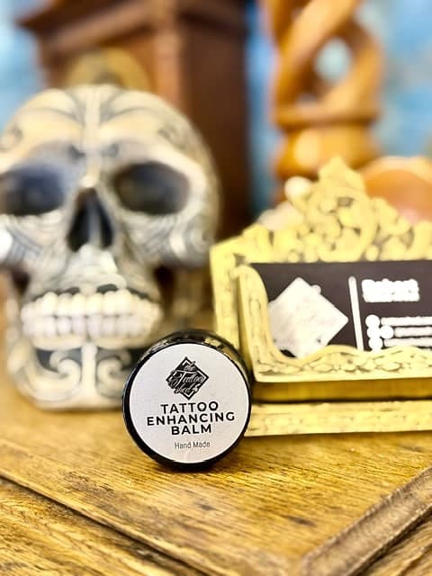 A pot of the studio's hand-made tattoo enhancing balm